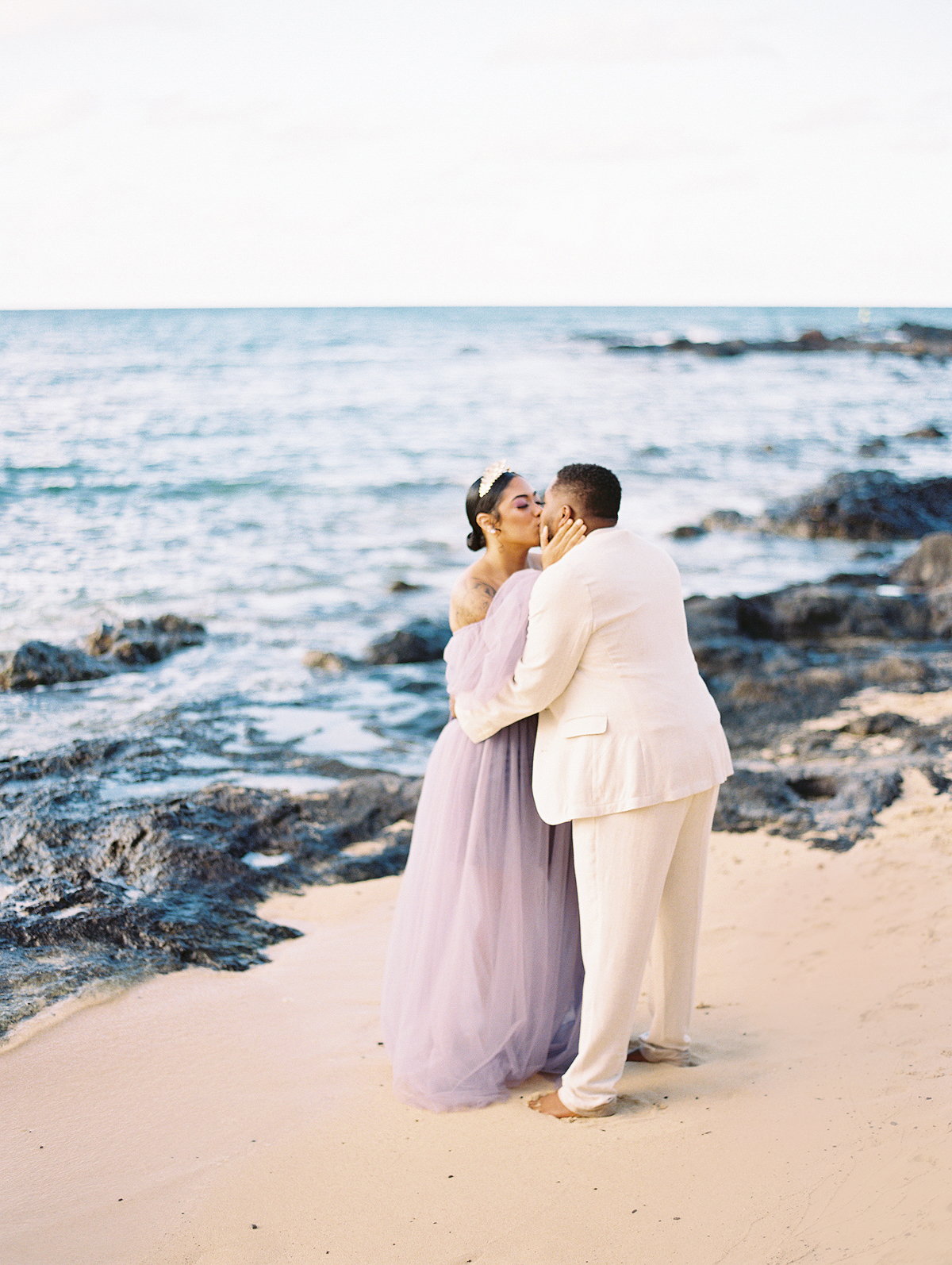Unique Hawaii beach wedding with purple gown by Laura Ivanova Photography