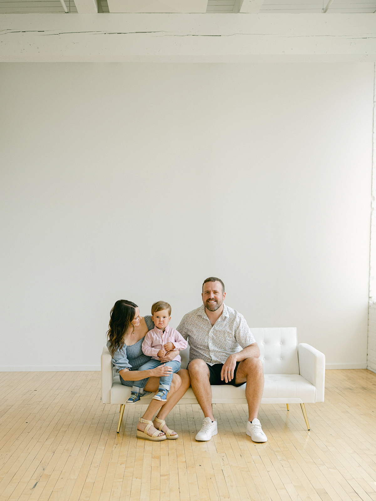 Minneapolis family photographer, Laura Ivanova, captured this family + maternity session at her natural light studio in Northeast Minneapolis