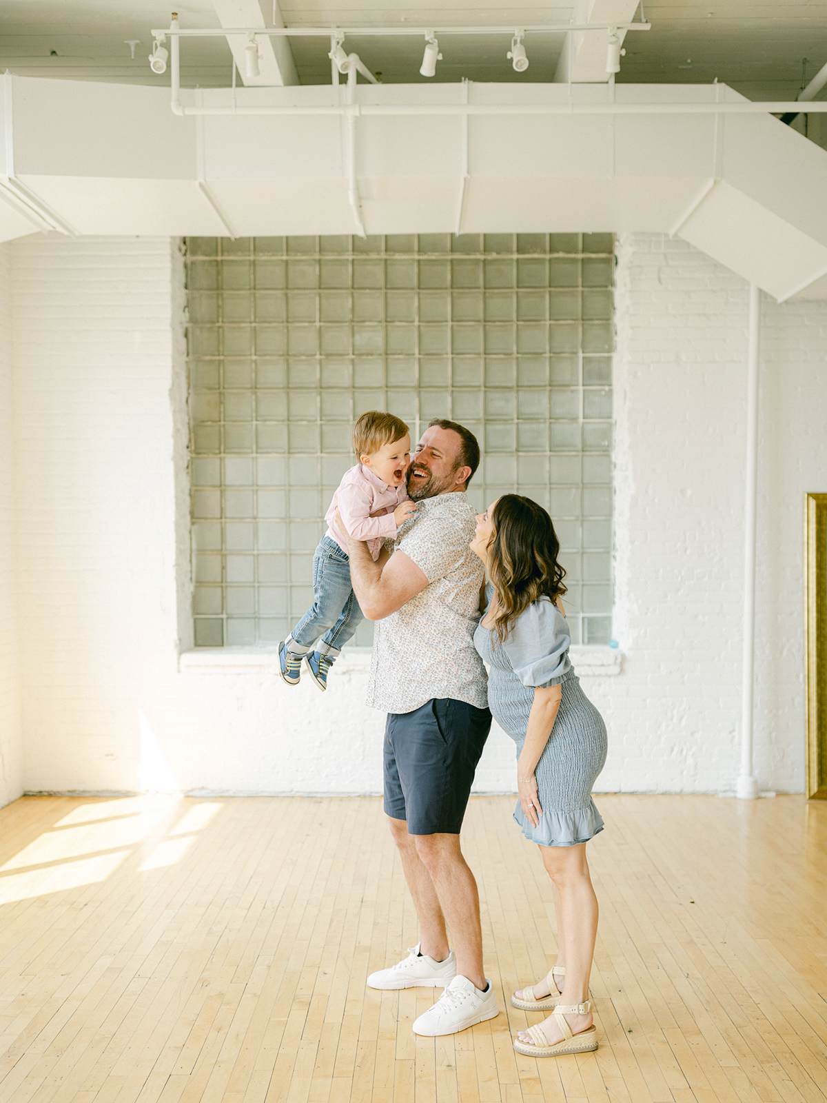 Minneapolis family photographer, Laura Ivanova, captured this family + maternity session at her natural light studio in Northeast Minneapolis