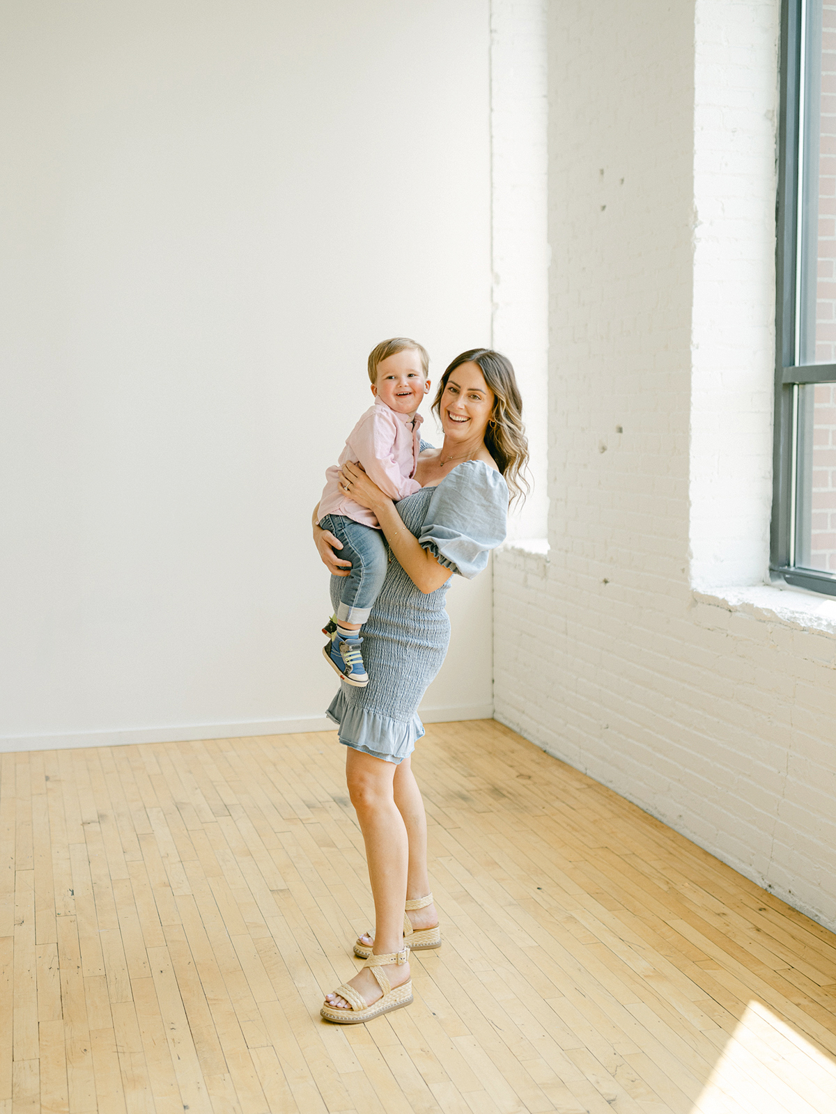 Minneapolis family photographer, Laura Ivanova, captured this family + maternity session at her natural light studio in Northeast Minneapolis