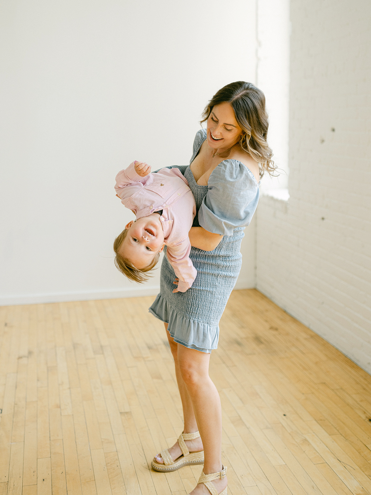 Minneapolis family photographer, Laura Ivanova, captured this family + maternity session at her natural light studio in Northeast Minneapolis