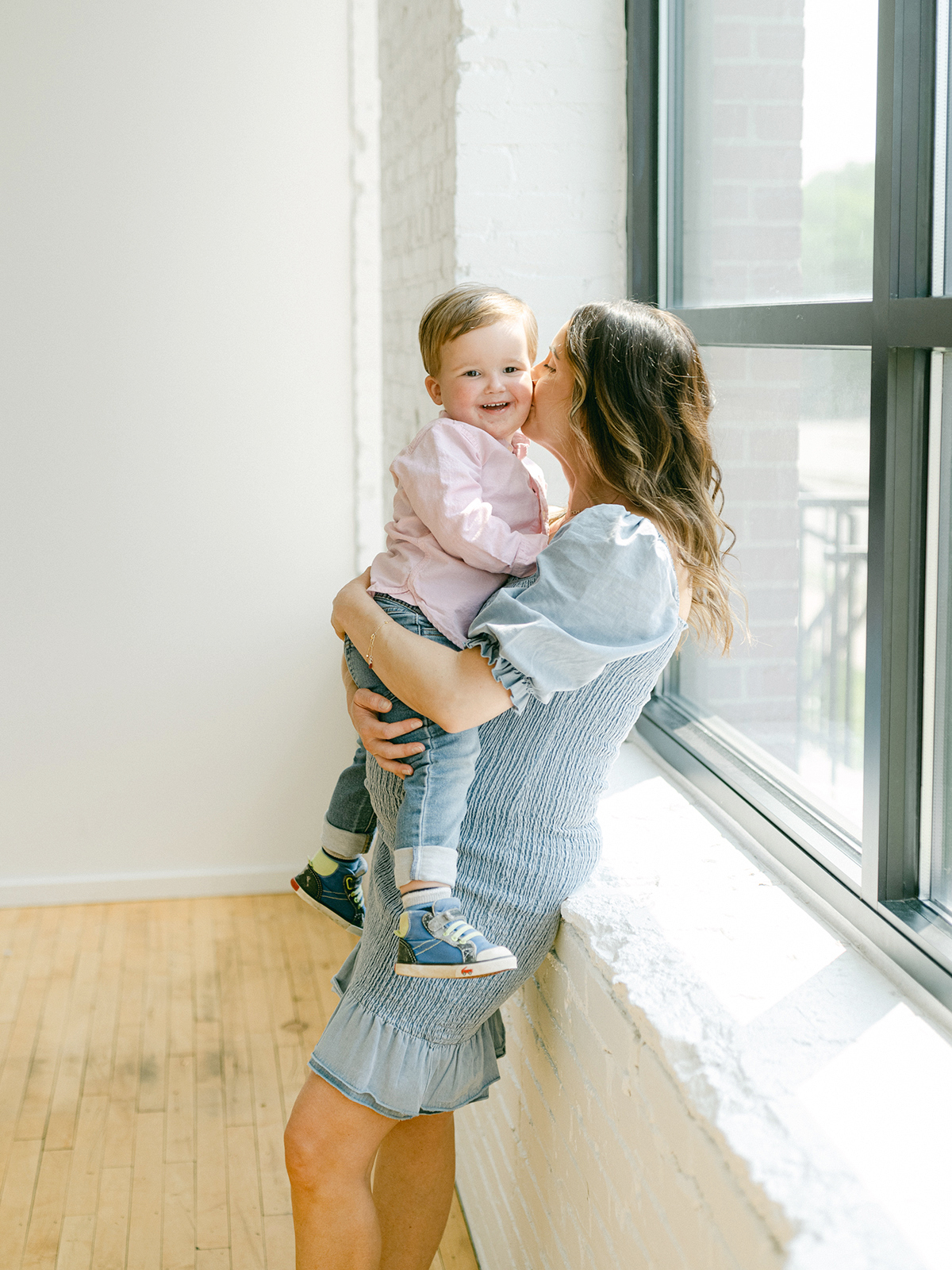 Minneapolis family photographer, Laura Ivanova, captured this family + maternity session at her natural light studio in Northeast Minneapolis