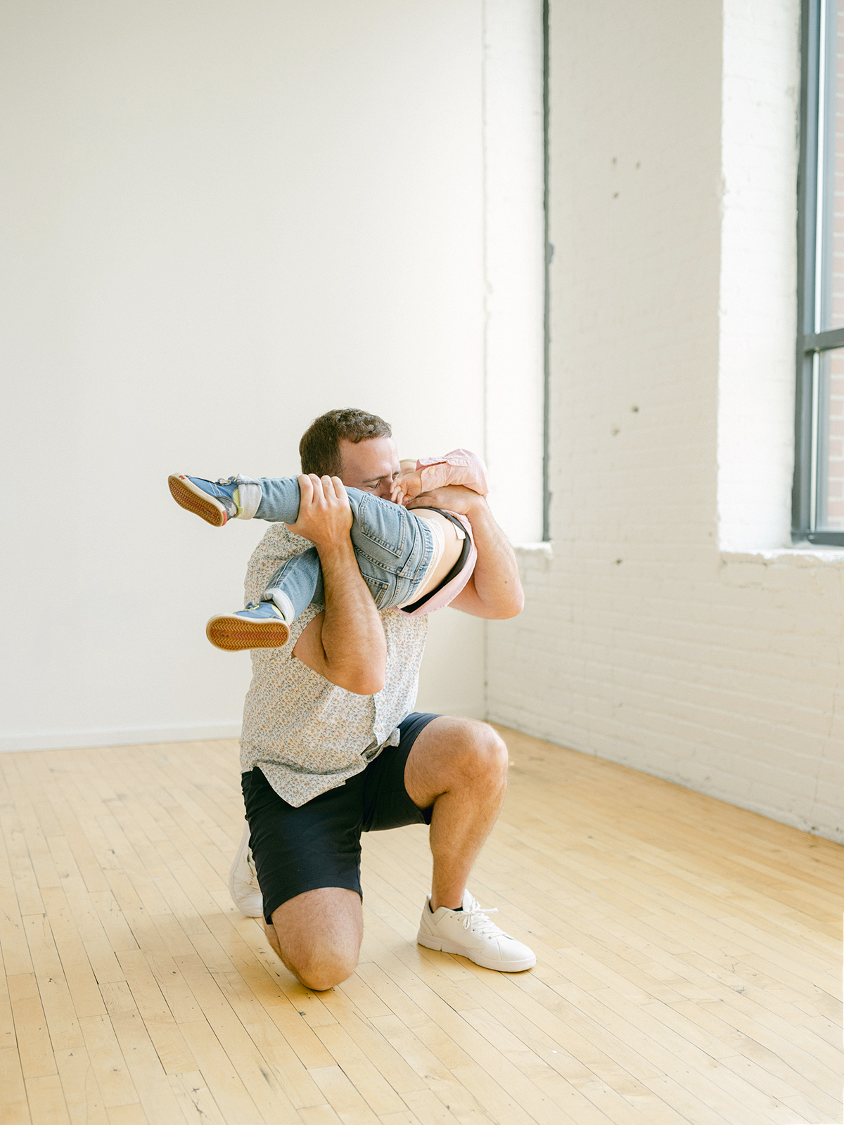 Minneapolis family photographer, Laura Ivanova, captured this family + maternity session at her natural light studio in Northeast Minneapolis