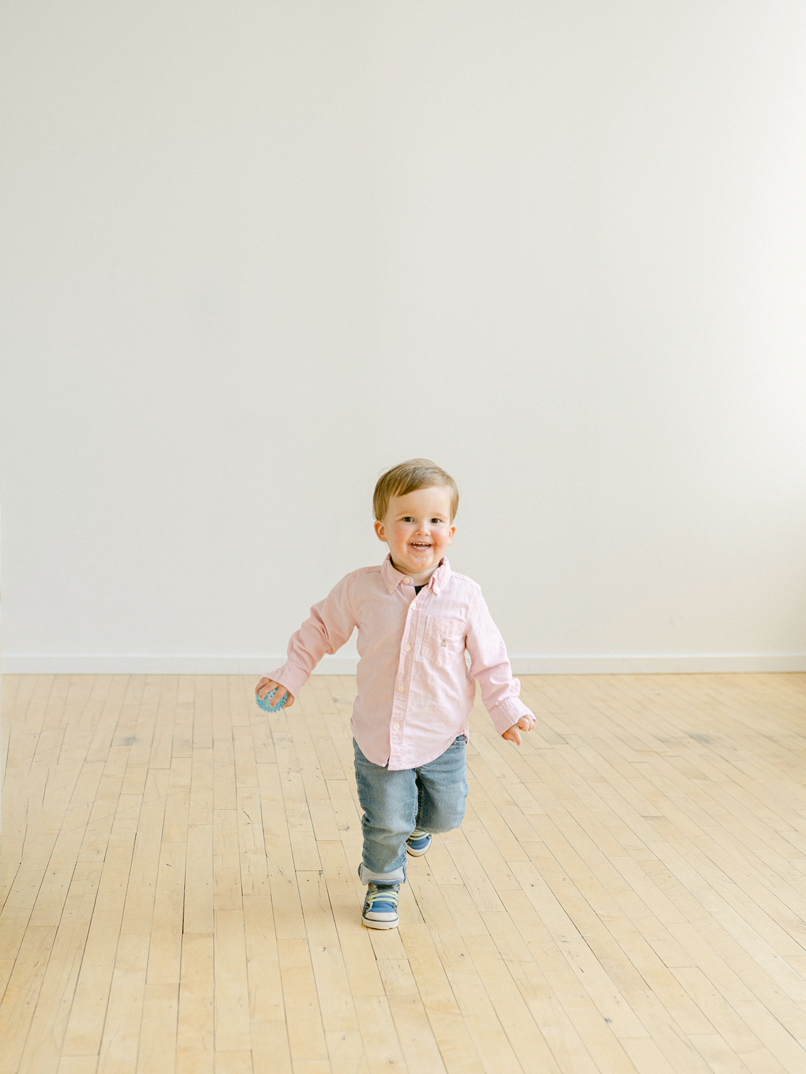 Minneapolis family photographer, Laura Ivanova, captured this family + maternity session at her natural light studio in Northeast Minneapolis