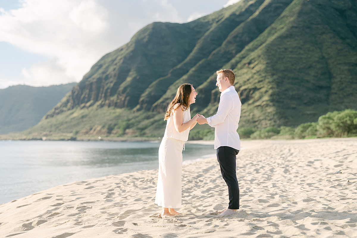 Oahu proposal photographer, Laura Ivanova, captures a surprise sunset proposal in gorgeous Hawaii