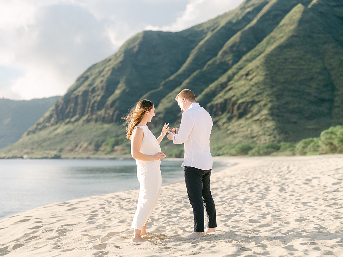 Oahu proposal photographer, Laura Ivanova, captures a surprise sunset proposal in gorgeous Hawaii