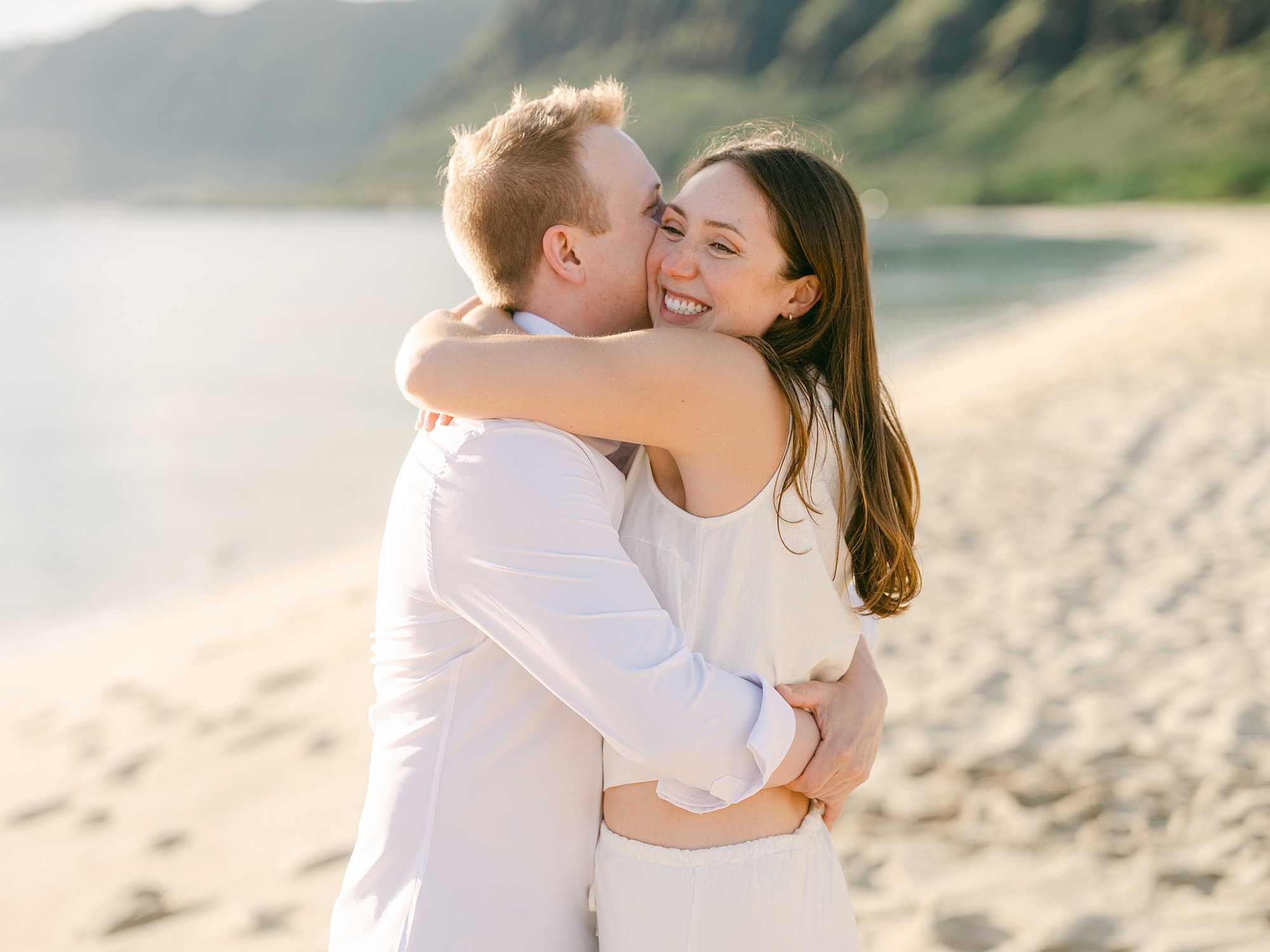 Oahu proposal photographer, Laura Ivanova, captures a surprise sunset proposal in gorgeous Hawaii