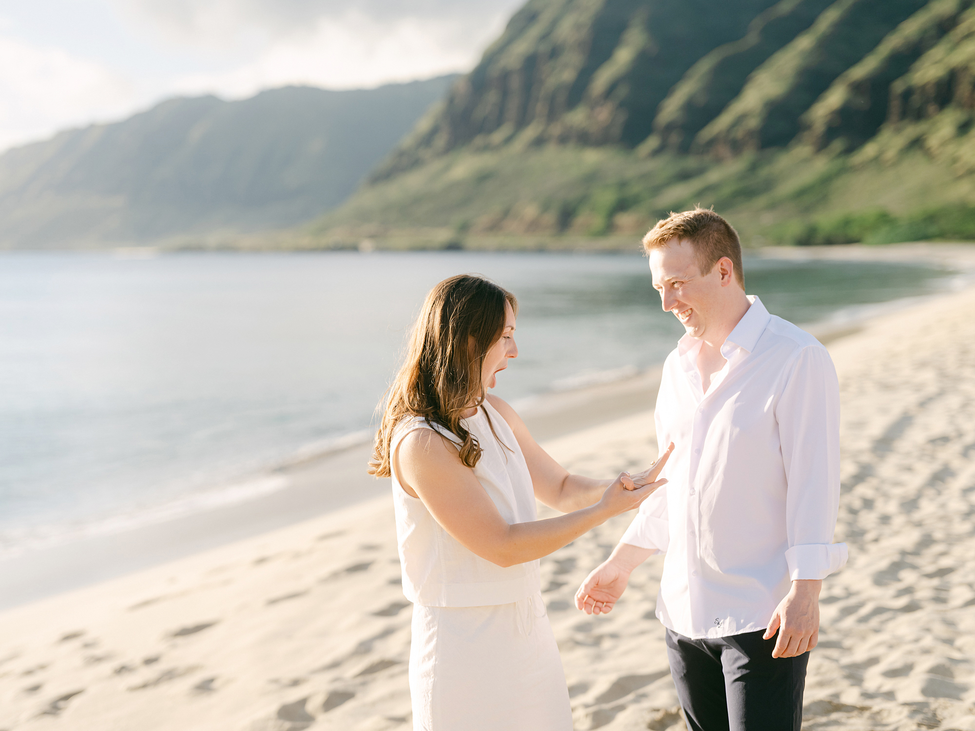 Oahu proposal photographer, Laura Ivanova, captures a surprise sunset proposal in gorgeous Hawaii