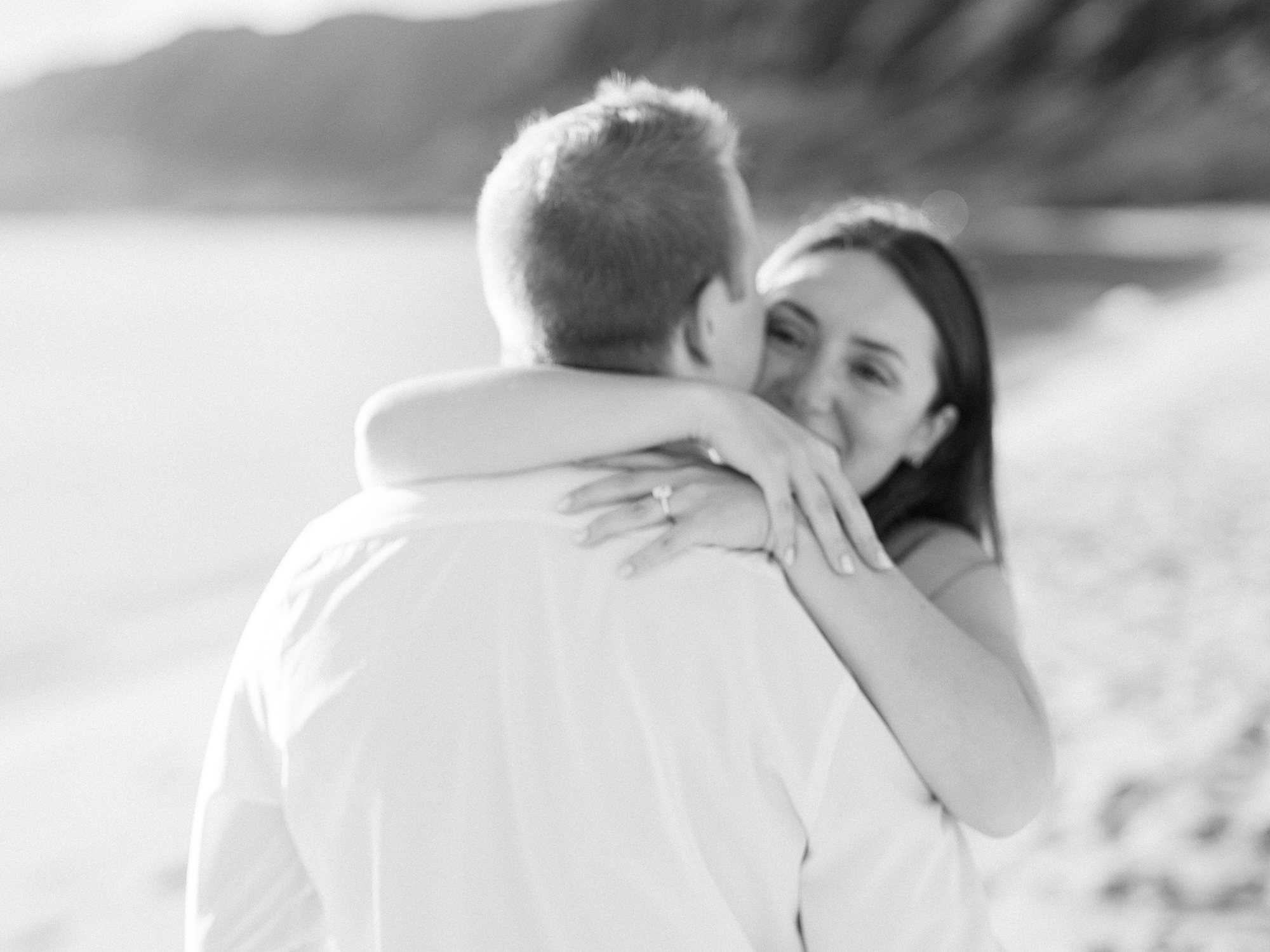 Oahu proposal photographer, Laura Ivanova, captures a surprise sunset proposal in gorgeous Hawaii