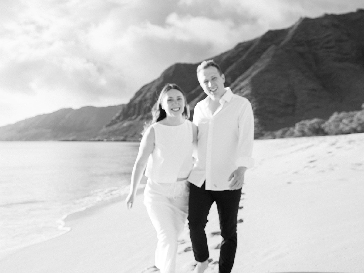 Oahu proposal photographer, Laura Ivanova, captures a surprise sunset proposal in gorgeous Hawaii