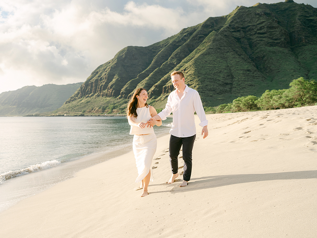 Oahu proposal photographer, Laura Ivanova, captures a surprise sunset proposal in gorgeous Hawaii