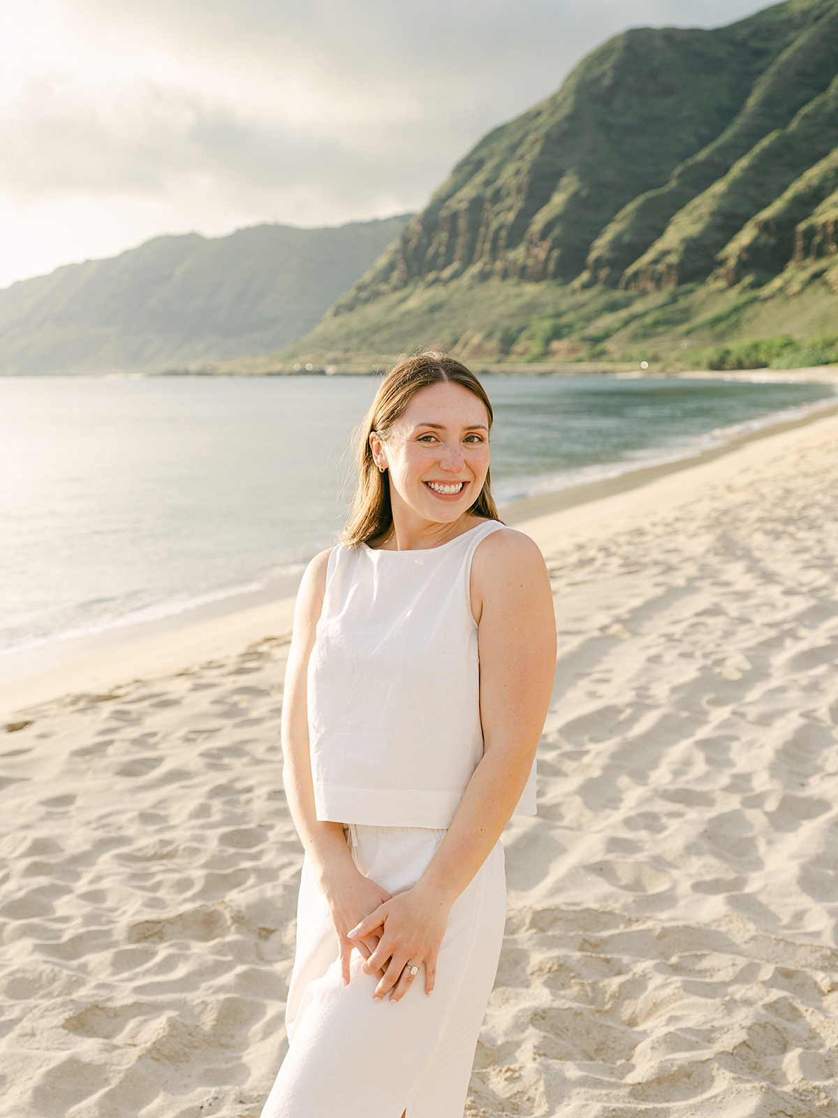 Oahu proposal photographer, Laura Ivanova, captures a surprise sunset proposal in gorgeous Hawaii