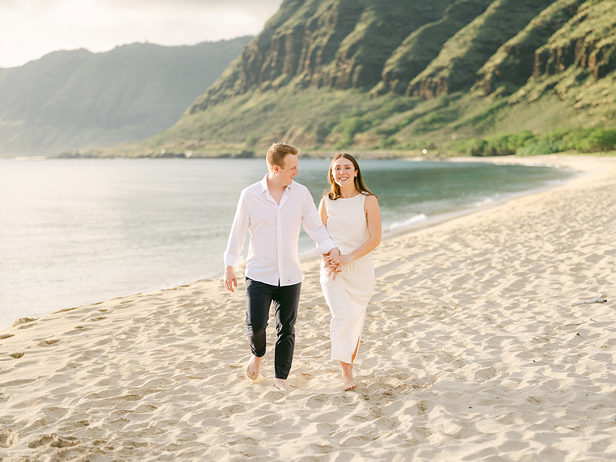 Oahu proposal photographer, Laura Ivanova, captures a surprise sunset proposal in gorgeous Hawaii