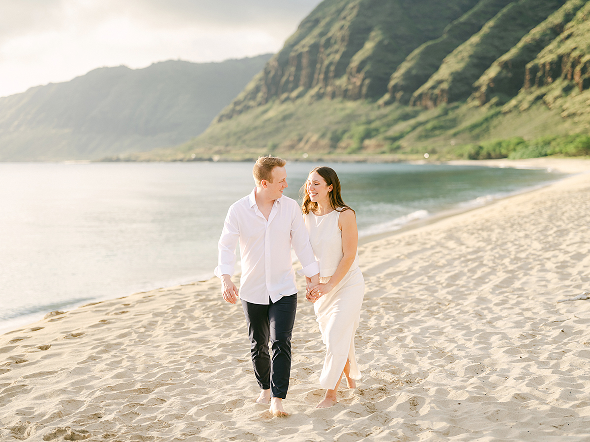 Oahu proposal photographer, Laura Ivanova, captures a surprise sunset proposal in gorgeous Hawaii