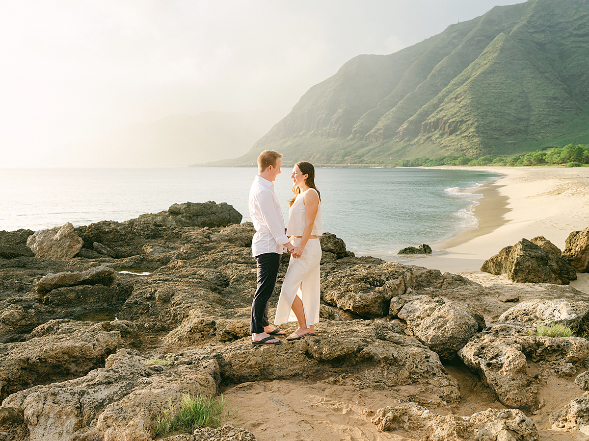 Oahu proposal photographer, Laura Ivanova, captures a surprise sunset proposal in gorgeous Hawaii